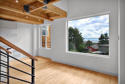 INDUSTRIAL-STYLE QUEEN ANNE TOWNHOUSE WITH VIEWS OF THE WATER FROM EVERY FLOOR!