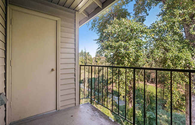 Balcony with view of trees