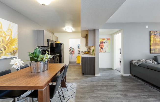 the living room and dining room of an apartment