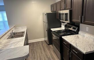 a kitchen with a stove and a sink