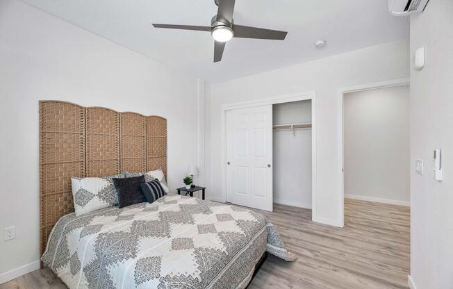 a bedroom with a bed in a room