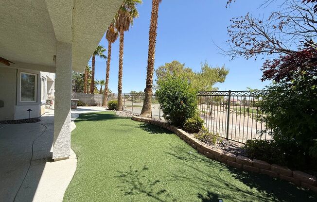 GORGEOUS 2 STORY HOME WITH A GRAND ENTRY & GOLF COURSE VIEW LOCATED INSIDE THE COMMUNITY OF RHODES RANCH