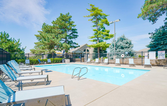 Swimming pool with lounge chairs for sunbathing