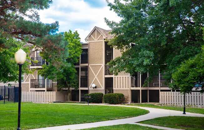 A building with a white fence in front of it.