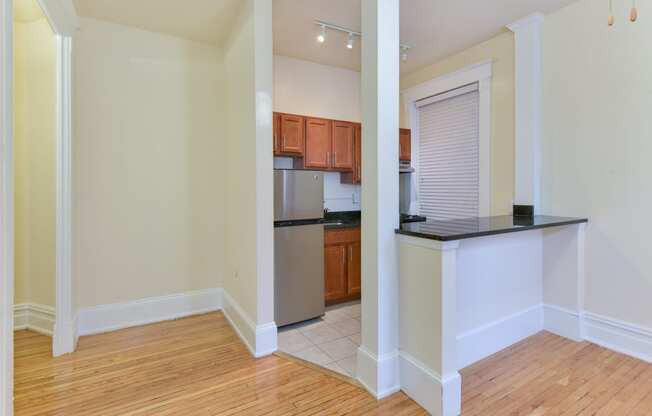 view of kitchen with stainless steel appliances and breakfast bar at dupont apartments in washington dc