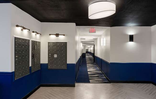 A hallway with lockers with white and blue walls at Elme Alexandria, Virginia, 22304