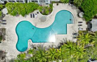 an aerial view of the pool at the resort