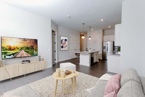 a living room with a couch and a coffee table in front of a tv at Fairfax, Grandview, 43212