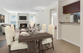 A dining room with a wooden table and white chairs.