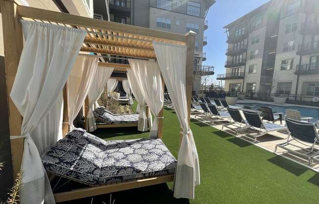 a bedroom with a canopy bed next to a pool