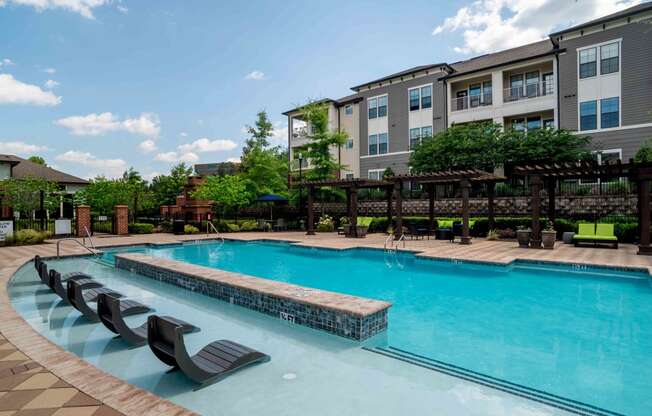 our apartments have a large swimming pool with chairs