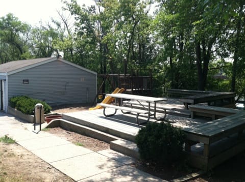 a patio with a picnic table and a fire hydrant