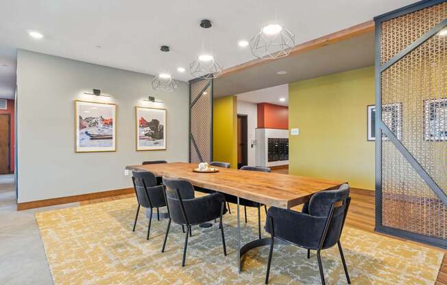 A conference room with a long table and chairs.