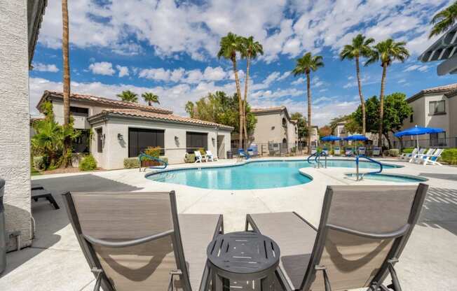 Bayside Apartments Pool with Lounge Chairs