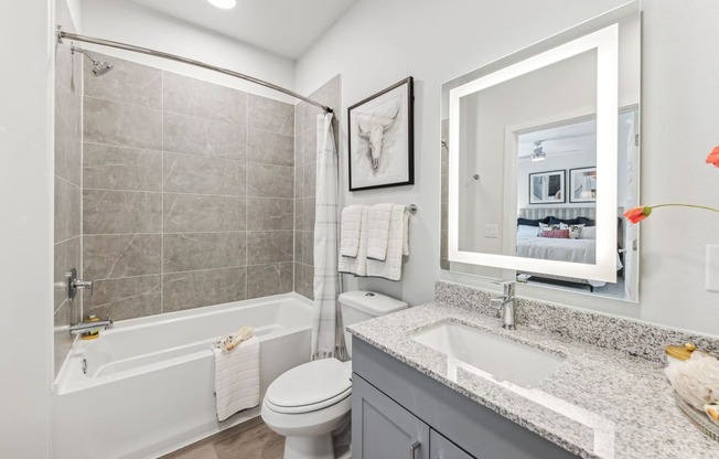 a bathroom with a sink toilet and a shower
