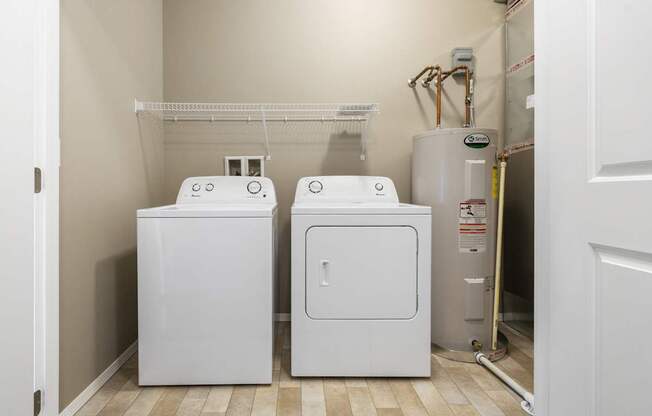 A white washer and dryer in a small laundry room.