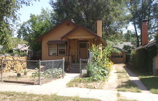 Charming Central Bungalow with Fireplace, Fenced Yard & Oversized Garage!