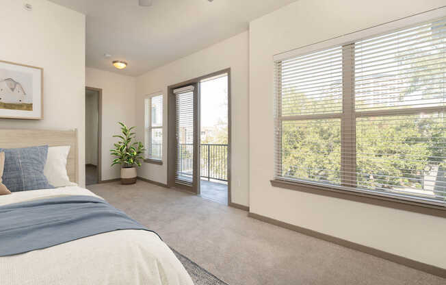 Carpeted Bedroom with Balcony