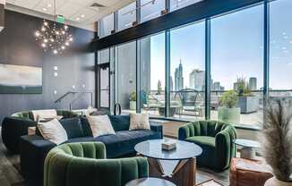 A modern living room with a view of the city skyline.