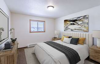 a bedroom with a bed and a window. Fargo, ND Plumtree Apartments