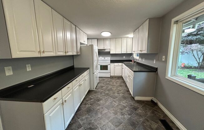 4 Bedroom 2 bath Home on Quiet Street with Lots of Storage