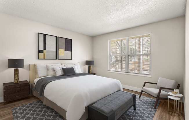 a bedroom with a large bed and a window  at Arcadia Apartments, Centennial, CO