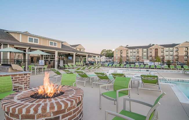 the preserve at ballantyne commons fire pit and pool with lounge chairs and buildings