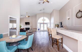 a living room filled with furniture and a large window