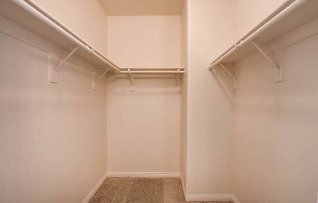 A room with white walls and a carpeted floor.