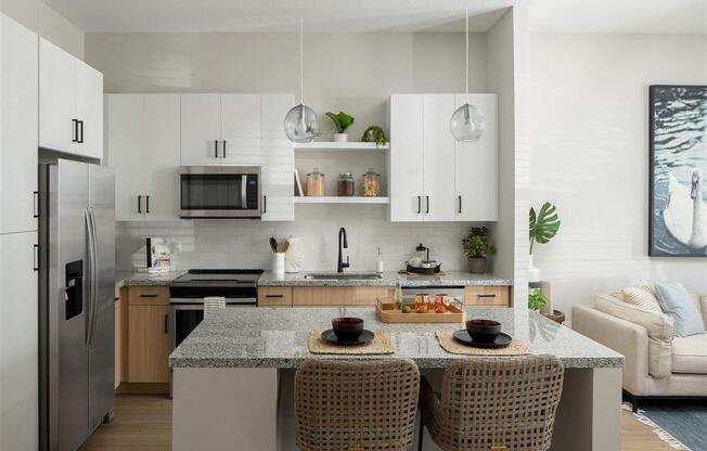 a kitchen with a center island with three stools