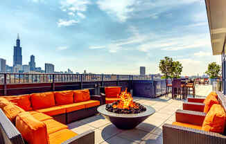 Resident rooftop lounge with a fire pit and skyline views of the Chicago at The Madison at Racine West Loop, Chicago, IL, 60607