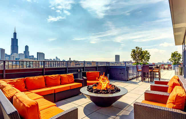 Resident rooftop lounge with a fire pit and skyline views of the Chicago at The Madison at Racine West Loop, Chicago, IL, 60607