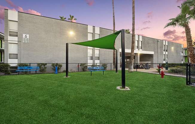 Community Dog Park with Benches and Canopy at Arcadia on 49th Apartments located in Phoenix, AZ.