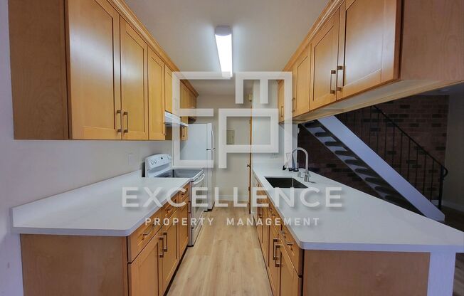 2/1 Townhouse - Updated Kitchen, Community Pool, Storage, One Side of 2 Car Garage (For Storage)