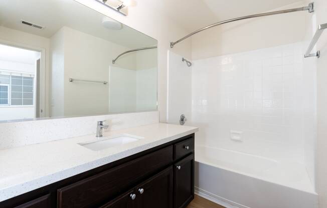 the preserve at ballantyne commons apartment bathroom with sink and shower