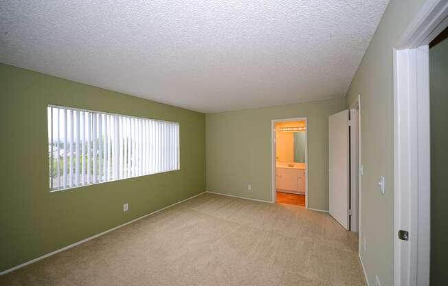 Ocean View Townhomes unfurnished bedroom with window