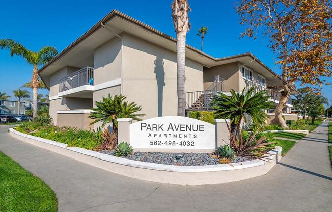 a building with a sign in front of it at  Park Avenue Apartments, Long Beach