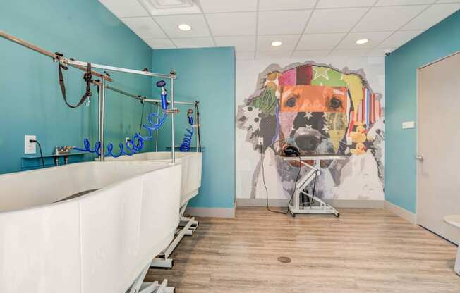 a bathroom with a large mural of a dog on the wall