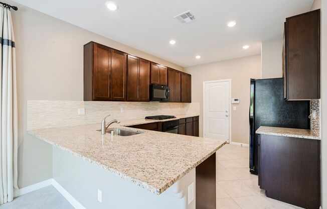 Look No Further! Lovely 3 Bedroom And 2.5 Bathroom Is Located In The Beautiful Tule Springs Master Planned Community.