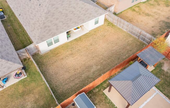 Enjoy open living with a kitchen featuring a breakfast bar sink island, gas range, and walk-in pantry. Relax in a master suite with a 5-foot shower and walk-in closet, plus a private backyard with covered patio and 6-foot fence.