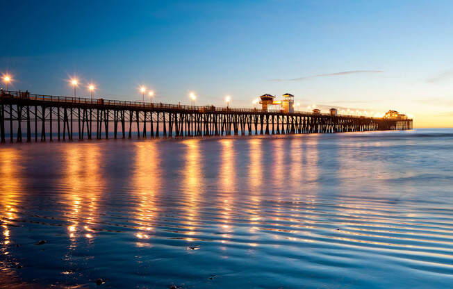 the pier at dusk at the beach