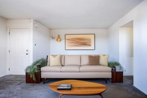 a living room with a couch and a coffee table