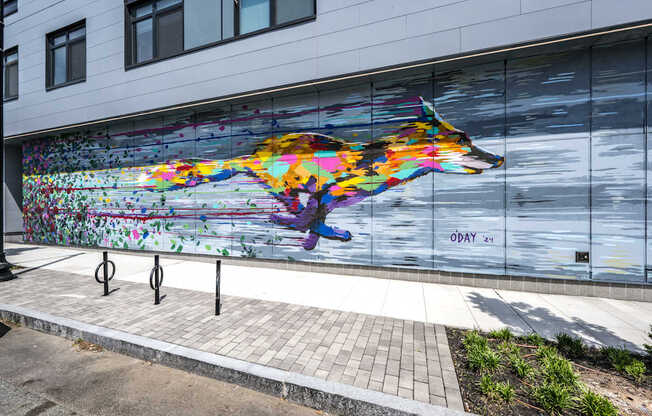 A mural of a wolf painted on a building.