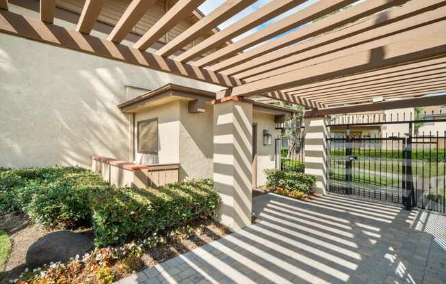 a patio with awnings and a staircase in front of a building