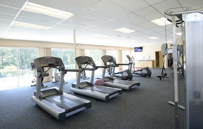 Fitness Center with Outside view at Woodridge Apartments, 3901 Noyes Circle, MD 21133