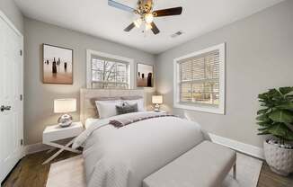 A bedroom with a bed, a ceiling fan at Balfour Marietta Apartments, Marietta