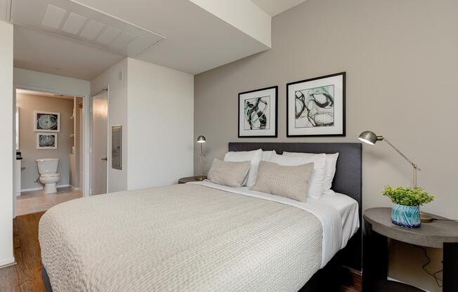 a bedroom with a large bed in a hotel room