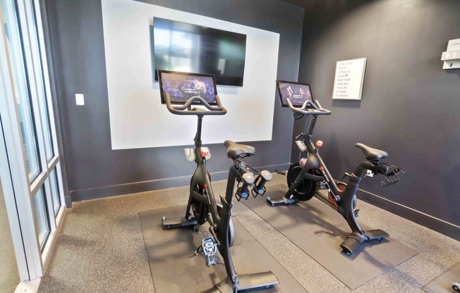 fitness center with peleton exercise bikes