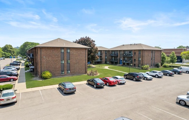 a large brick building with a parking lot in front of it at Lafayette Park Place, Detroit, MI, Detroit, MI