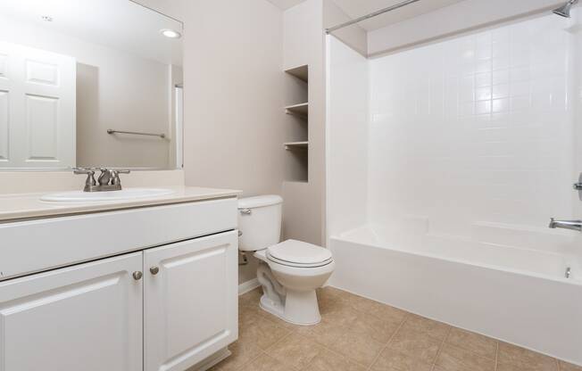 a bathroom with a bathtub toilet and sink